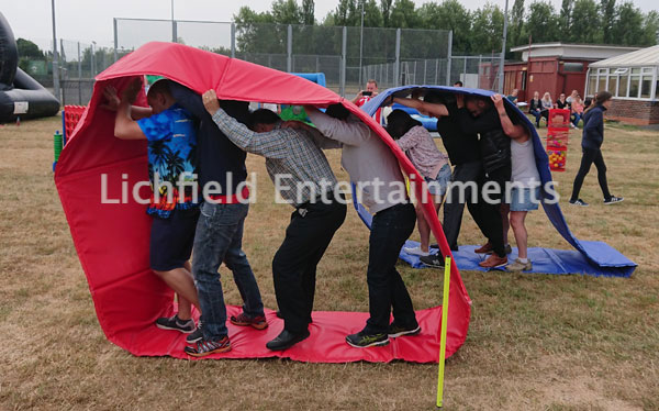 Human Caterpillar Racing game for hire for Team Building events