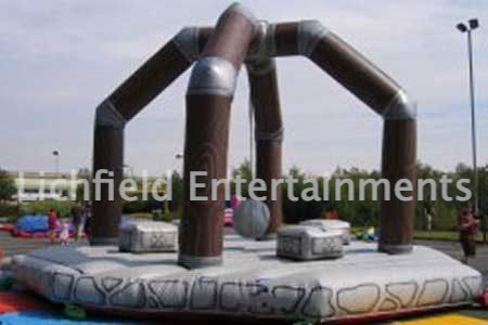 Human Demolition Wrecking Ball Inflatable for hire. Medieval themed inflatable game