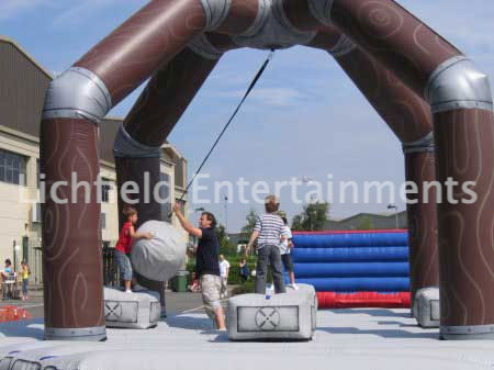 Human Demolition Wrecking Ball Inflatable for hire. Medieval themed inflatable game