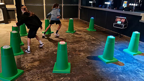 Run-around reaction cones layout with illuminated targets for a movement-based challenge